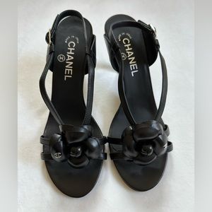 Brand new Chanel black heels with camellia flower.